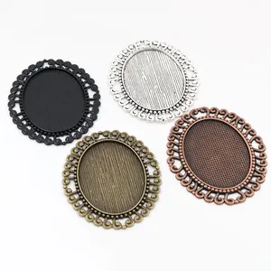 Set of 4 vintage oval alloy pendant trays for DIY jewelry in four metallic colors