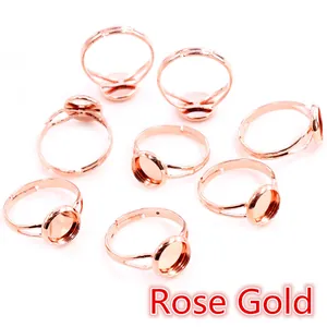 Macro shot of 8 rose gold adjustable ring bases with round settings for DIY jewelry making