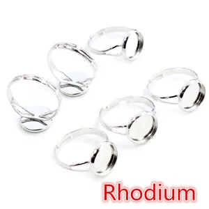 Macro detail of six rhodium-plated adjustable ring bases for DIY gemstone jewelry making