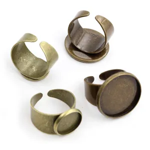 Detail of adjustable antique bronze ring settings for DIY jewelry making with flat bases