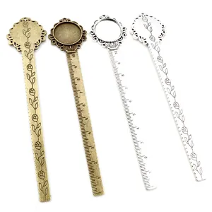 Set of four vintage alloy ruler bookmarks with floral relief and round gem base