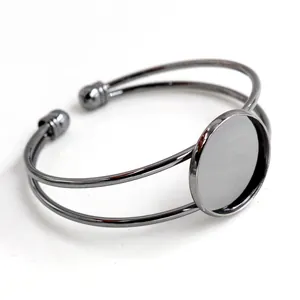 Macro detail of gunmetal plating open cuff bracelet base with 20/25mm round bezel tray