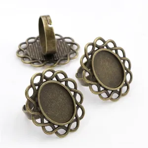 Antique bronze oval ring base with hollow lace pattern and adjustable open band for DIY