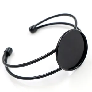 Detailed view of black plated copper open bangle with round bezel for DIY jewelry