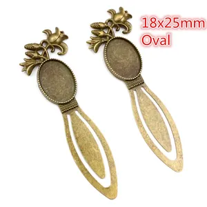 Detailed close-up of 18x25mm oval bronze bookmarks with vintage floral relief