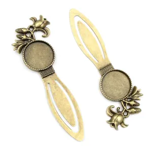 Detailed view of bronze alloy bookmark bases with vintage floral embossed patterns