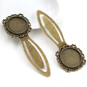 Pair of antique bronze 20mm bookmark bezel trays with hollow heart filigree patterns