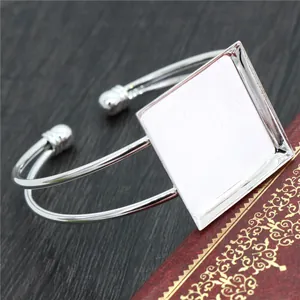 Silver square cabochon bracelet setting for DIY jewelry on vintage background