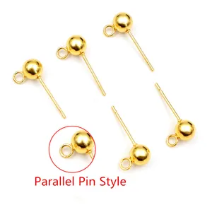 Detailed view of 5 golden stainless steel ball earring studs with hanging loops