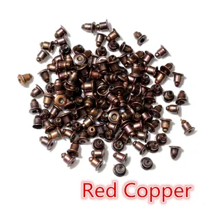 Detail view of bulk red copper bullet clutch earring backs for jewelry making and DIY projects