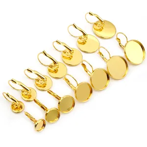 Supports de boucles d'oreilles dorés en acier inoxydable avec plateaux ronds pour bijoux DIY
