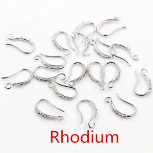 Detailed close-up of rhodium-plated earring hooks with shimmering micro-pave crystals