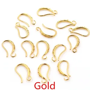 Multiple gold-plated copper 17x10mm ear wire hooks with U-shaped curve on white background