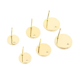 Detailed view of 6 gold stainless steel flat disc earring studs with hanging holes for DIY