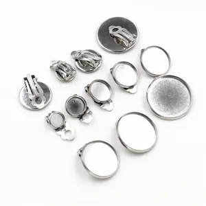 Set of various sizes stainless steel DIY clip-on earring bases on white background