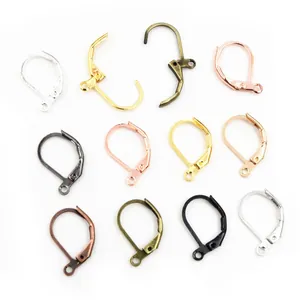 Detailed view of various metal lever-back earring hooks for DIY jewelry crafting