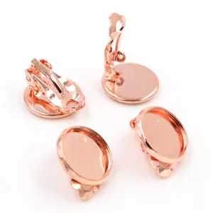 Macro view of four rose gold plated clip-on earrings with flat base trays for DIY