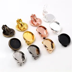 Assorted DIY metal clip-on earring bases with round trays in multiple metallic finishes
