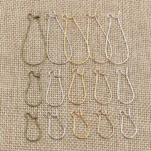 Crochets d'oreilles goutte DIY en plusieurs tailles et finitions sur fond de lin