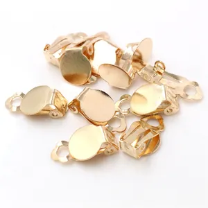 Macro shot of 10mm gold-plated flat tray clip-on earring converters for DIY jewelry making