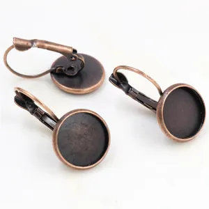Detailed view of antique bronze leverback earring hooks with round bezel trays for DIY