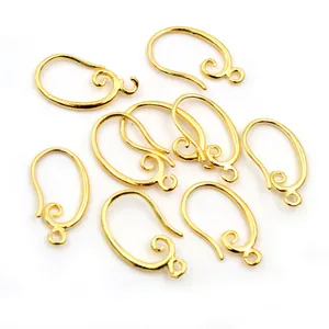 Eight pieces of shiny golden copper earring hooks with curled design for DIY jewelry making
