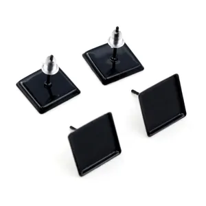 Detail showing 12mm black square earring base studs with silicone backs on white background