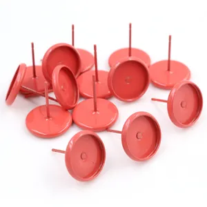 Close-up of matte red 10mm tray earring posts for DIY jewelry and resin crafts