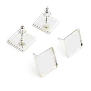 Close-up of 12mm square stainless steel earring bezel posts for DIY jewelry making