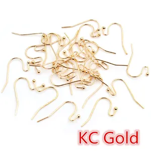 Detailed pile of 21x16mm KC Gold plated S-shape earring hooks with bead for DIY jewelry