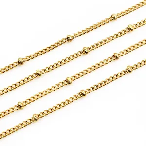 Macro shot of gold-plated curb chain with small cylinder beads for DIY jewelry making