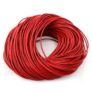 Macro view of bright red round leather cord spool for DIY jewelry making and crafts