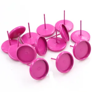 Macro shot of 10mm matte pink earring studs and metal tray blanks for DIY jewelry