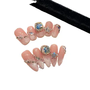 Roze gradiënt glitter plaknagels met luxe laser-strass en zilveren kleurdetails