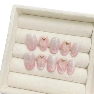 Faux ongles faits main œil de chat rose avec gouttes d'eau 3D et motif de pêche
