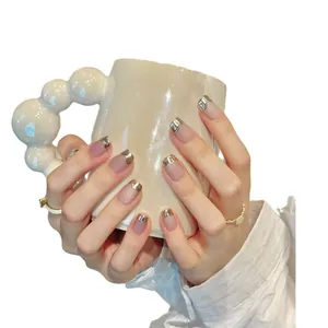 Pink cat eye press-on nails with silver mirror French tips and matte nude finish