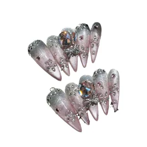 Pink and silver gradient handmade press-on nails with luxury gemstones and bow charms