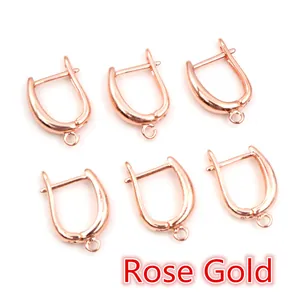 Detailed view of six rose gold U-shaped earring hooks for DIY jewelry making