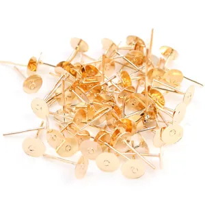 Bulk gold plated flat pad ear studs for DIY jewelry making displayed on white background