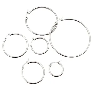 Polished silver stainless steel hoop earrings in various sizes on a white background