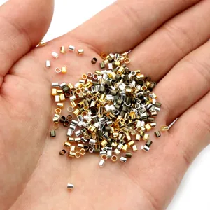 500pcs colorful metal crimp beads for jewelry making shown in hand for size scale