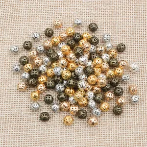 Hollow metal filigree beads in gold silver and bronze for DIY jewelry making accessories