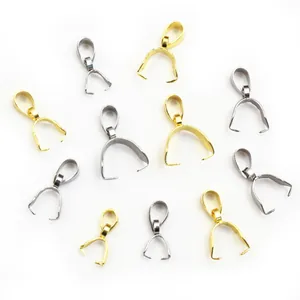 Macro view of gold and silver stainless steel pinch bails in various sizes for DIY jewelry