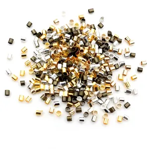 DIY jewelry making crimp beads in various metallic finishes on a clean white background