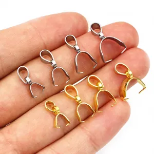 Stainless steel pinch bails in gold and silver colors shown on hand for size scale