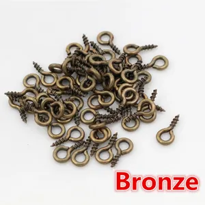 Detailed view of bronze screw eye pins for DIY jewelry making and pendant crafting