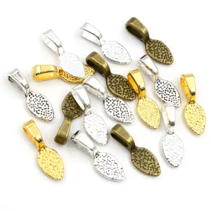 Leaf shaped metal pendant connectors with hammered texture in gold silver and bronze