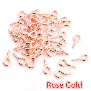 Macro shot of rose gold metal eye pin screws for DIY jewelry pendant connectors