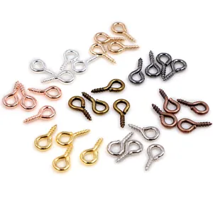 Assorted metal eye pin screws for DIY jewelry charms in gold silver and bronze finishes