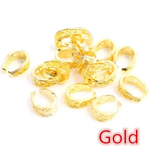 Macro view of gold-plated alloy pinch bails with vintage granulated texture for jewelry DIY